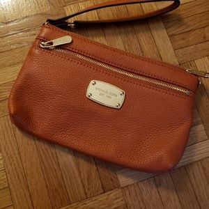 burnt orange Michael Kors wristlet